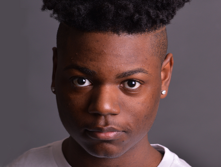 headshot of an actor with exotic hairstyle