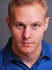 headshot of a young actor in dc with intense look