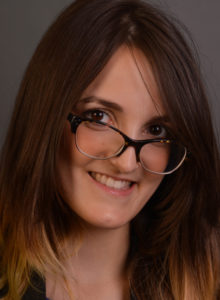 headshot of an actress in dc with glasses