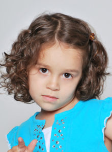 head shot of a child actor looking at the camera