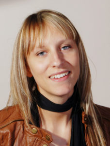headshot of a woman actor with blonde hair and blue eyes