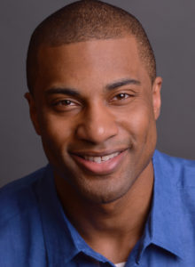 headshot of an actor in dc with a hint of a smile
