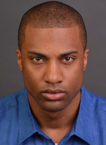 headshot of a young actor in dc with an intense look
