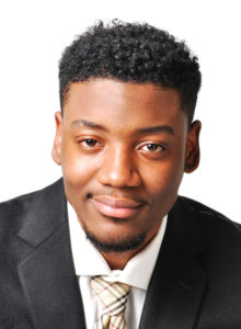 actor headshot ideas: young black actor in dark suit
