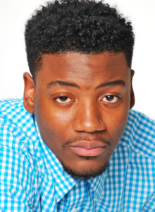 actor headshot ideas: young black actor in blue shirt