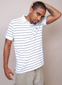 picture of a black male model in white striped shirt standing