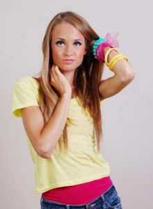 headshot of a model with fun colors and edgy pose looking up