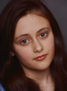 headshot of a child actress in dc with a pensive look