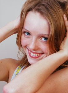 headshot of an aspiring teen model smiling