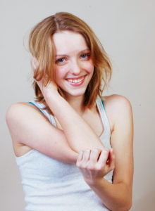 headshot of an aspiring teen model in a shy girl pose