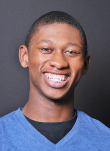 actor headshot hints: teen actor in dc wearing a blue shirt and a big smile
