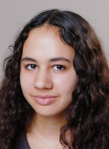 actor's headshots ideas: female teen drama actor with a hint of a smile