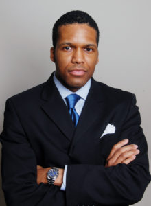 actor's headshot of a black man in dc in a business suit