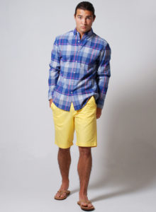 picture of a male model with blue checkered shirt and yellow shorts