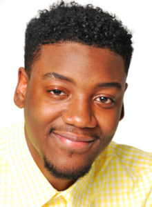 actor headshot of a young man in dc with a yellow shirt