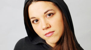 actor's headshot of a young aspiring actress with hooded shirt