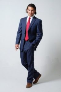 picture of a male model in dark suit and red tie