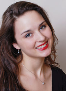 headshot of a dancer choreographer with her head tilted smiling