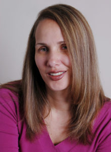professional headshot of a female news reporter in washington dc leaning her head smiling