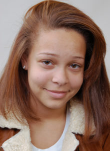 headshot of a teen actress with a beautiful smile