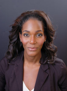 headshot of a female actor with a comical smile