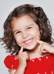 headshot of a child actress with an amusing expression on her face