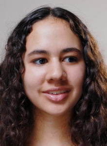 headshot of a teen drama actress with a dramatic look