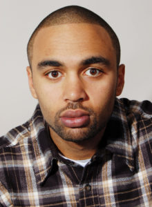 actor's headshot of a young black man in dc