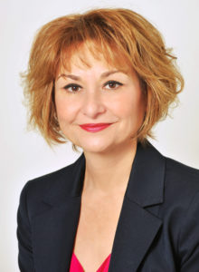 business headshot of a female executive in washington dc wearing a dark blue suit
